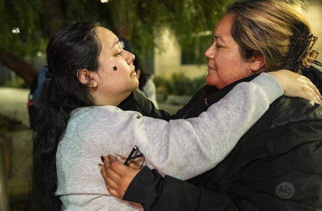 Damaris Bello, left, embraces her mother, Maria de Jesus Estrada Juarez, after Estrada Juarez exits the San Ysidro pedestrian crossing on Monday, March 30, 2026. Estrada Juarez returned to the United States on humanitarian parole following a federal court order requiring the government to facilitate her reentry after her February deportation.