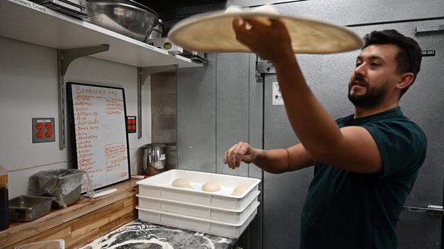 Owner Juanes Ramazzini spins pizza dough on Oct. 10, 2024, at Bambina’s Pizza and Pasta.