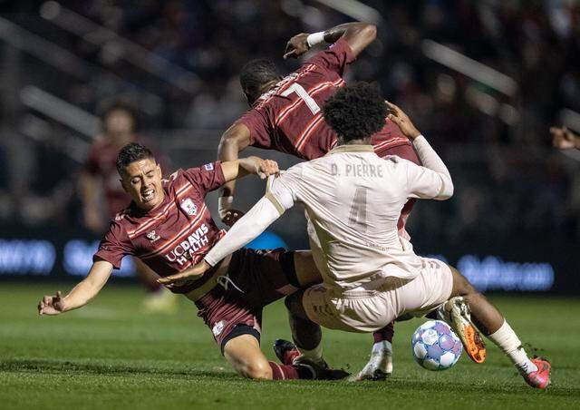 FC Tulsa’s Delentz Pierre gets tangled up with Republic FC’s Mayele Malango (7) and Arturo Rodriguez (10) in the first half Saturday at Heart Health Park in Sacramento.