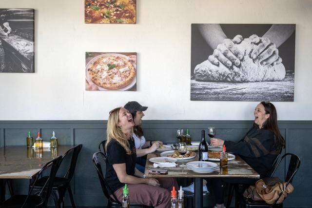 Lauren Titus, Lindsay Foletta, and Kathleen Gormley enjoy their lunch at Dodici Pizza in Sacramento on March 6.