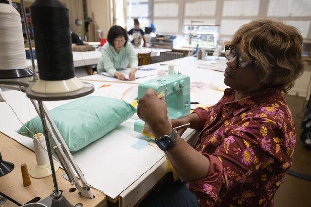 Linda Riccardo Henderson, right, works on sewing a pillow while Bev Tanaka makes an apron in an upholstery class at A. Warren McClaskey Adult Center in East Sacramento earlier this month.