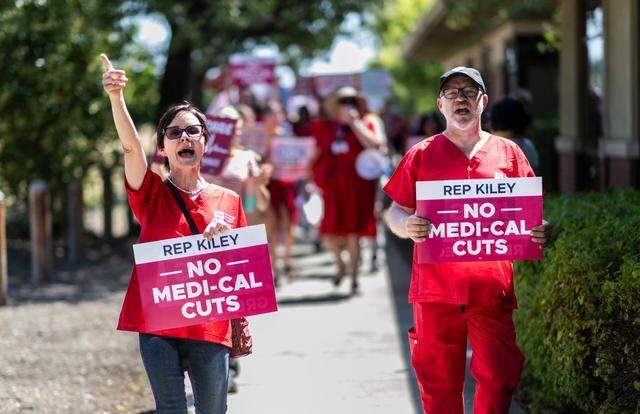 Rocklin nurses rally against the Republican megabill outside Rep. Kevin Kiley’s district office last year. Proponents of the wealth tax say it’s needed to avoid deep cuts to health care in California.