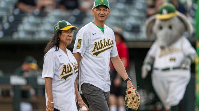 West Sacramento Mayor Martha Guerrero and Sacramento Mayor Kevin McCarty prepare to throw the first pitch during a MLB game at Sutter Health Park between the Athletics and the Baltimore Orioles on Friday, June 6, 2025. The two are leading a group to win a bid for a MLB team.