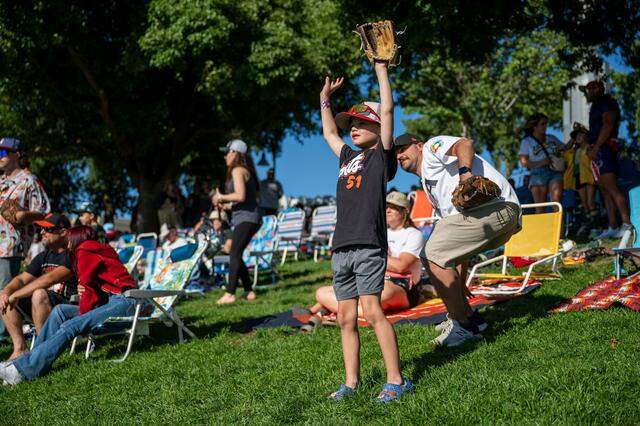 Riley Mosby, 6, hopes to get the attention of a San Fransisco Giants player for a ball at right field fence before the team’s first game against the Athletics at Sutter Health Park on Friday, July 4, 2025.