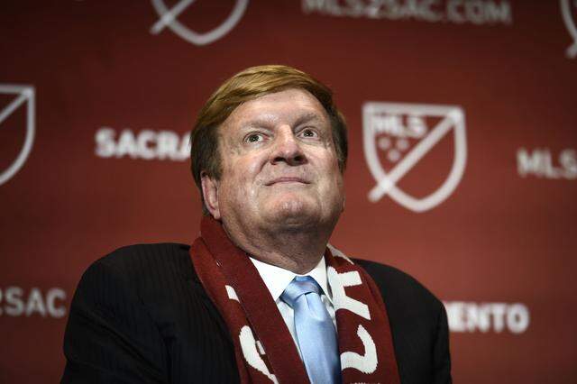 Grocery store magnate Ron Burkle sits on a stage in downtown Sacramento during a 2019 press conference announcing a Major League Soccer franchise for the city.  Burkle ultimately backed out of the agreement, citing business concerns relating to the COVID-19 pandemic.