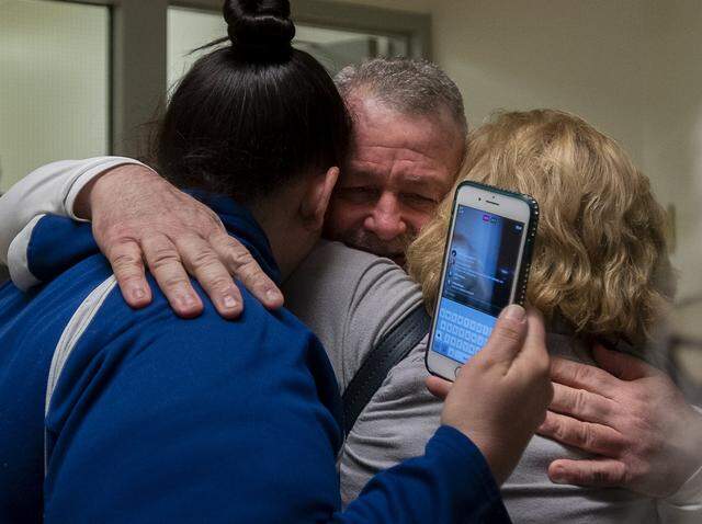 Ricky Leo Davis is released from custody and hugs mom Maureen Klein, right, and another family member at the El Dorado County Jail after he was exonerated in the 1985 murder of Janet Hylton on Thursday, Feb 13, 2020 in Placerville. DNA evidence used to exonerate Davis led police to arrest another suspect Tuesday.