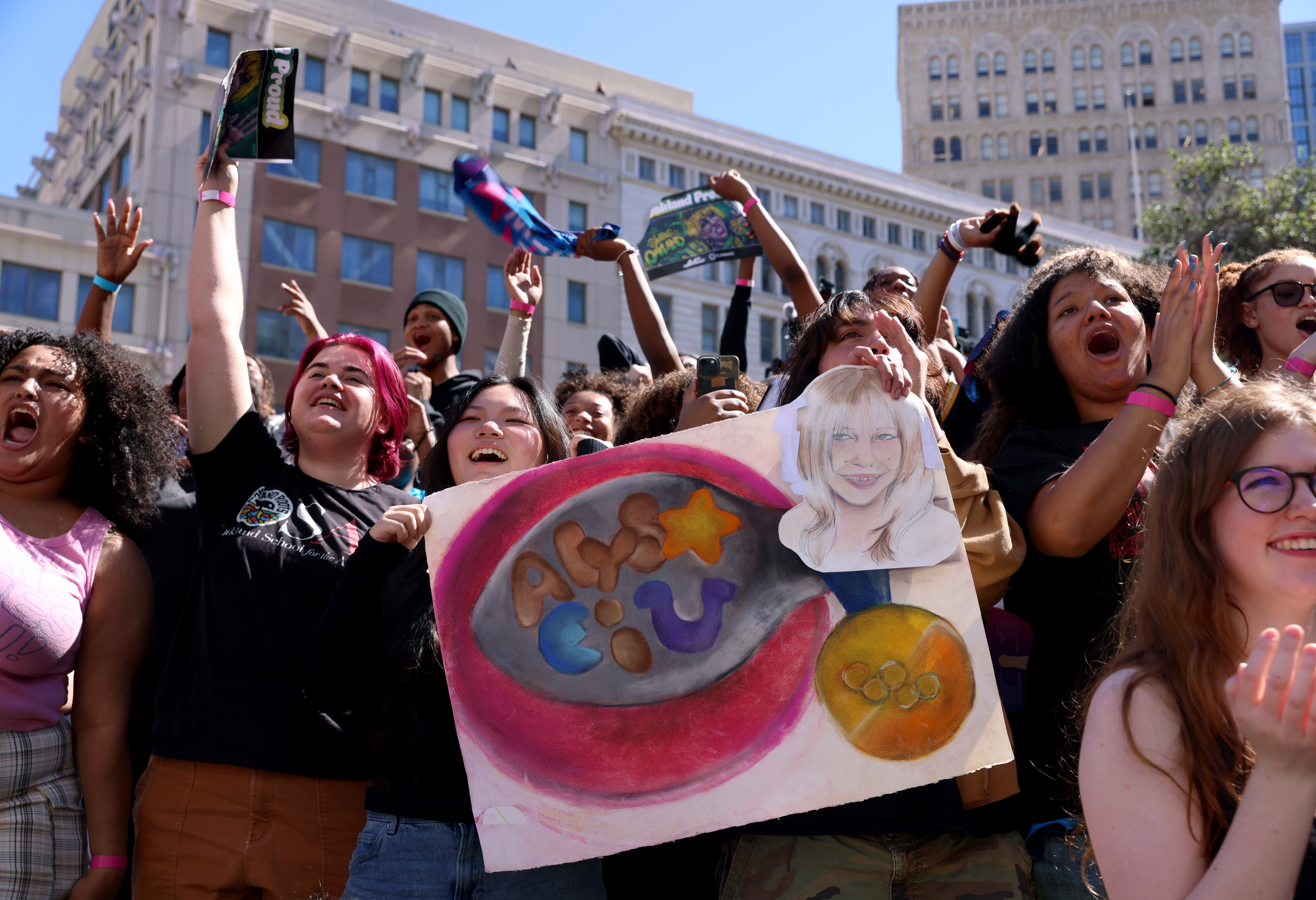 People cheer during a celebration for Olympic double gold medal...