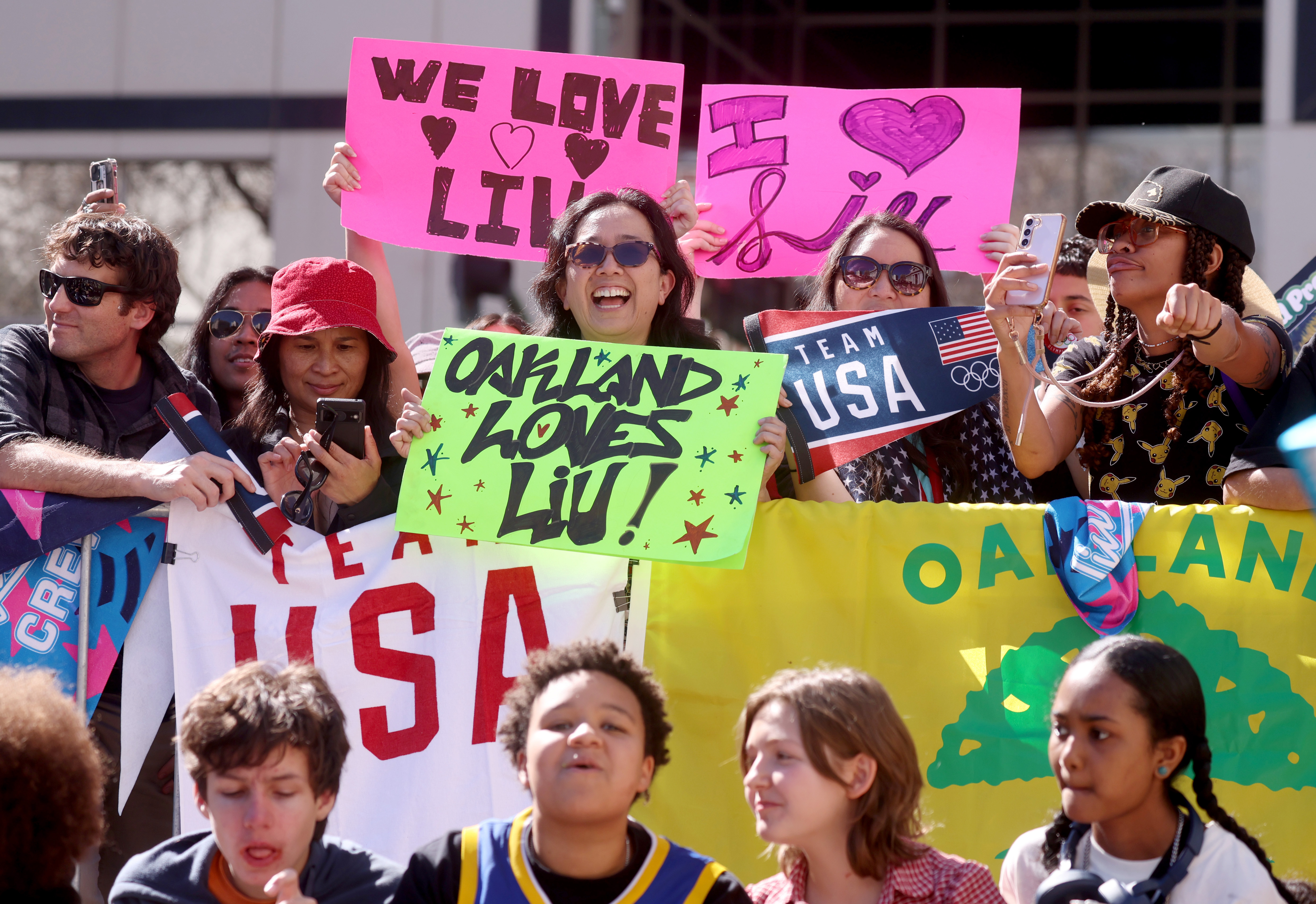 People cheer during a celebration for Olympic double gold medal...