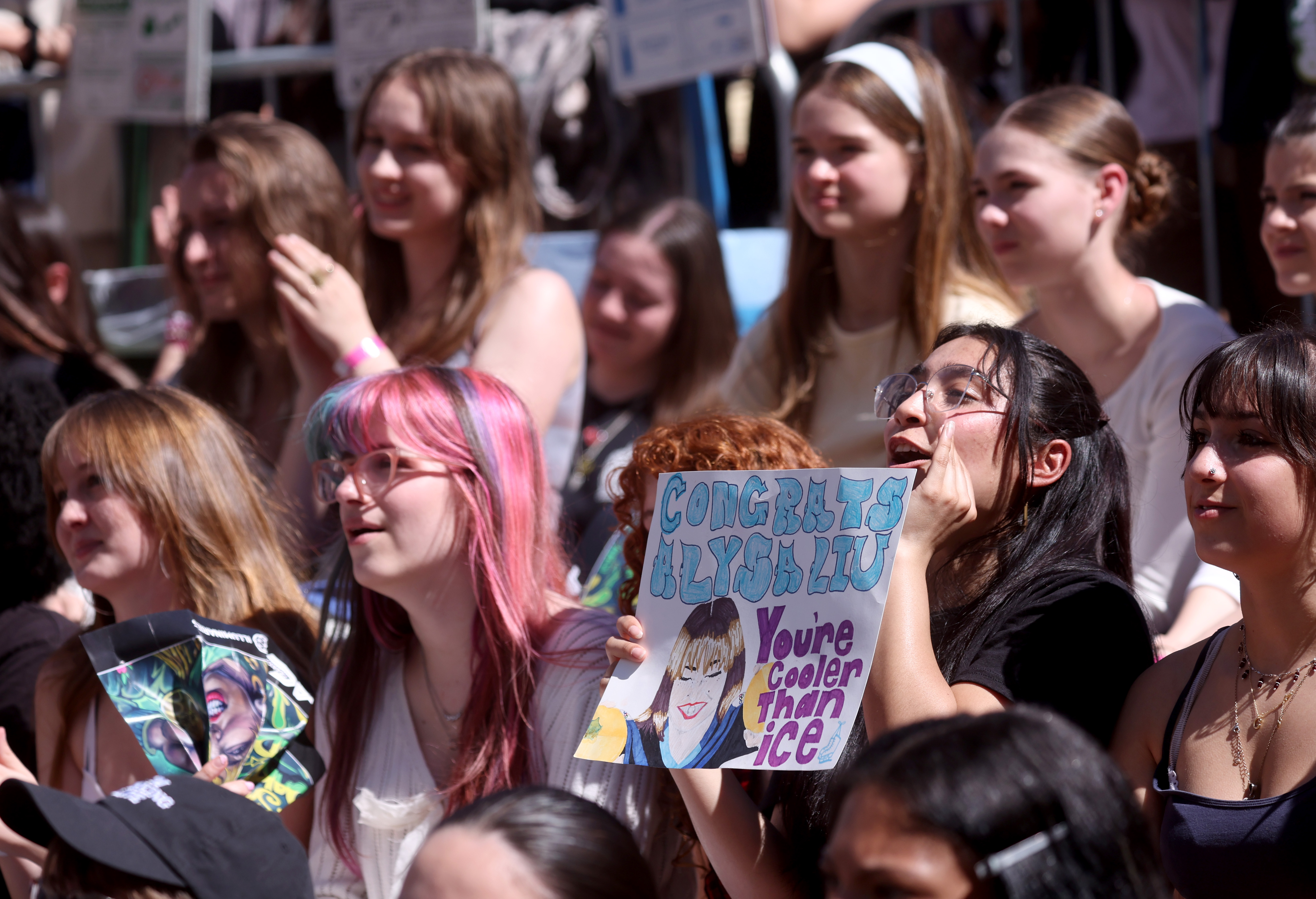 People cheer during a celebration for Olympic double gold medal...