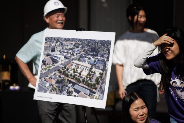 A rendering of the $15 million Dharma Center is displayed as attendees participate in a groundbreaking ceremony on Thursday, March 12, 2026, in San Jose's Japantown. The center will house a preschool, Sunday religious classes, a Japanese language school, and other San Jose Buddhist Church Betsuin and community activities. (Dai Sugano/Bay Area News Group)