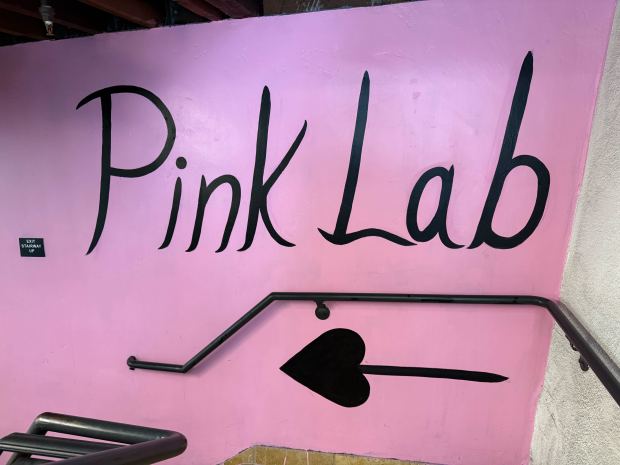 A sign points the way to Pink Lab gym in downtown San Jose on Saturday, March 7, 2026. (Iris Sanchez/Mosaic)