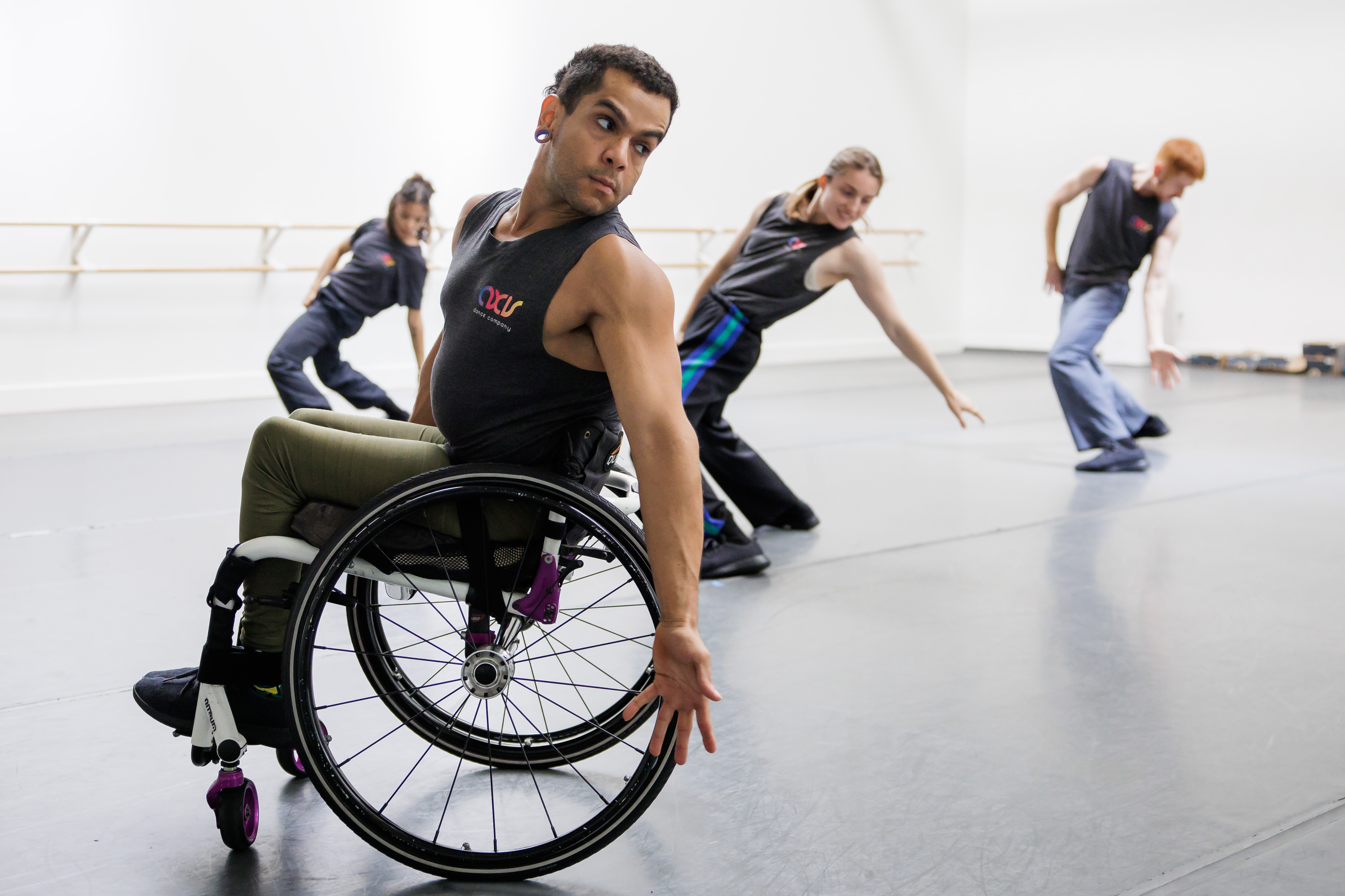 AXIS Dance Company dancers including JanpiStar, who is a wheelchair...