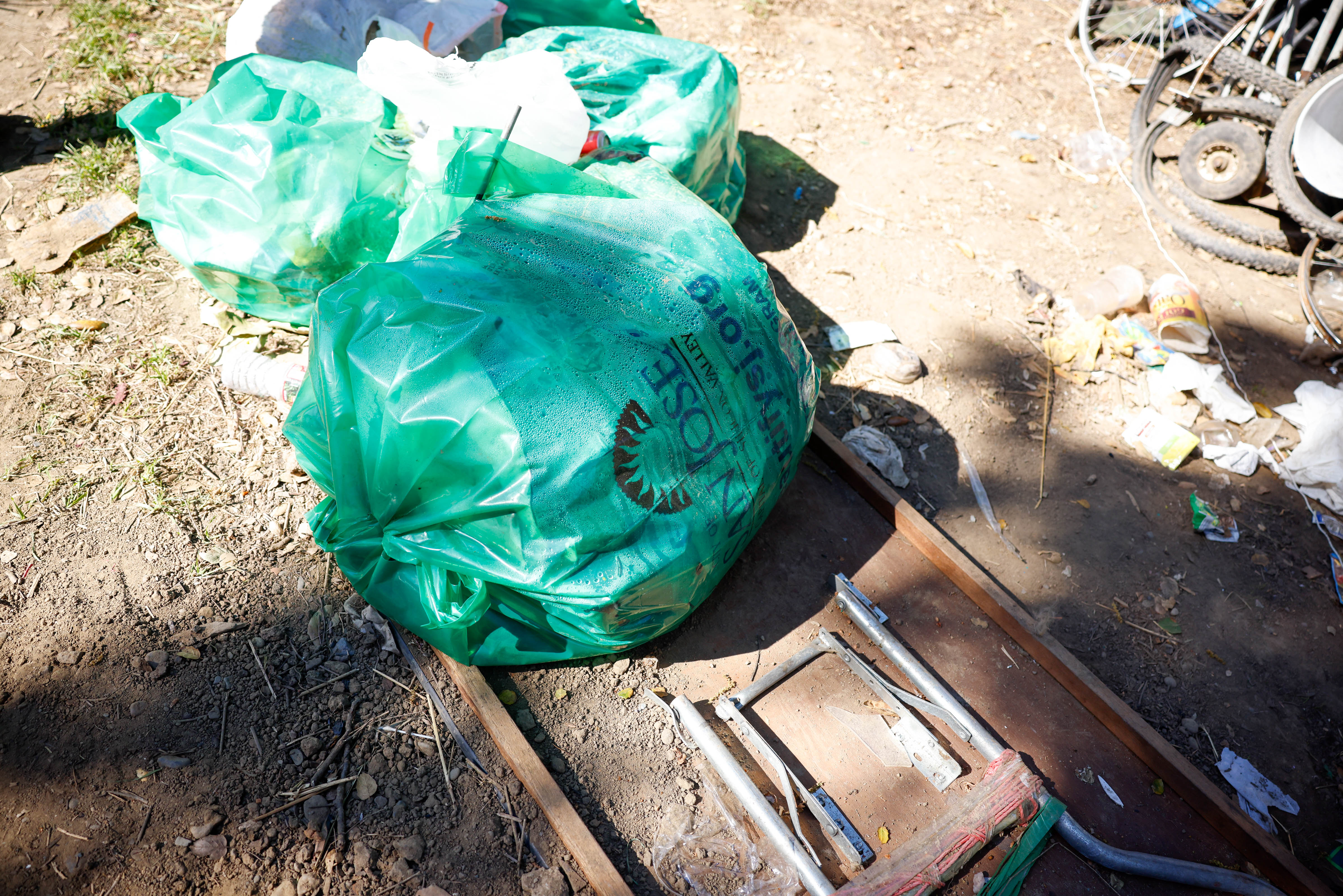 Trash bags provided from the city are filled with trash...