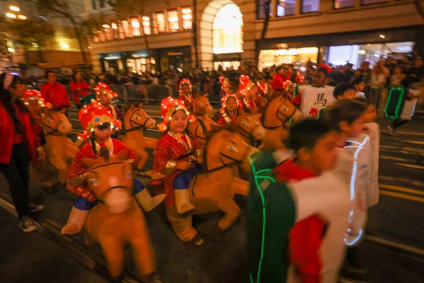 A group of kids with inflatable horses take part in the Chinese New Year Parade celebrating the Year of the Horse in San Francisco, Calif., on Saturday, March 7, 2026. (Ray Chavez/Bay Area News Group)