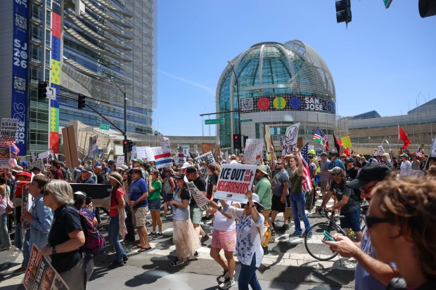 People gather during a No Kings protest in downtown San Jose, Calif., on Saturday, March 28, 2026. (Shae Hammond/Bay Area News Group)