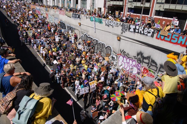 Thousands of protesters march on 11th street during the No Kings Protest in Oakland, Calif., on Saturday, March 28, 2026. (Jose Carlos Fajardo/Bay Area News Group)