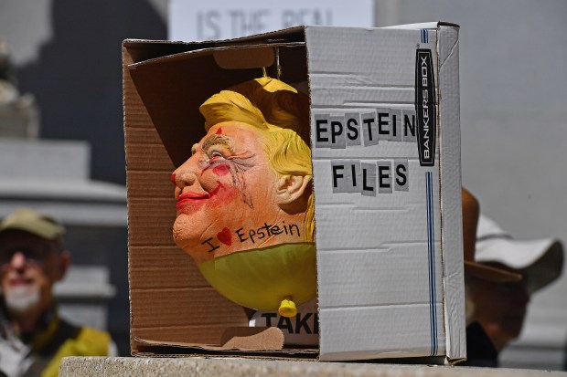 A protester dispalys a mask of President Donald Trump during the No Kings Protest in Oakland, Calif., on Saturday, March 28, 2026. (Jose Carlos Fajardo/Bay Area News Group)