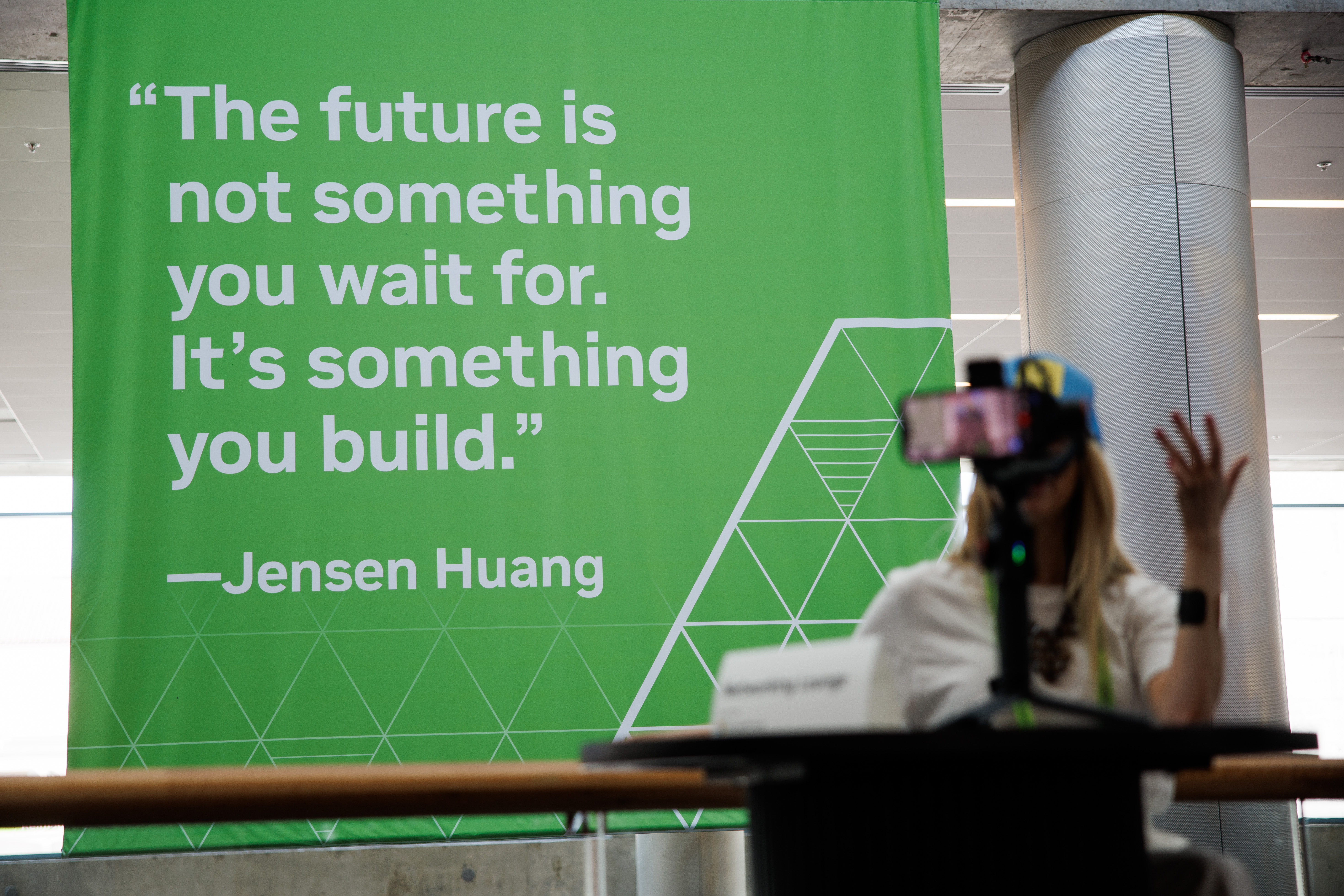 A quote by Nvidia CEO Jensen Huang is displayed at...