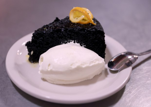 Chocolate cake with mandarini and vanilla cream is served at Bar Panisse on Shattuck Avenue in Berkeley, Calif., on Monday, Feb. 23, 2026. The restaurant is the latest project from Alice Waters, the California chef who helped start the slow food farm-to-table movement. (Jane Tyska/Bay Area News Group)