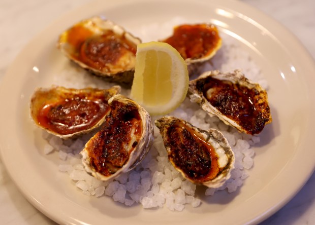 Broiled Hog Island sweet water oysters with 'njuda butter are served at Bar Panisse on Shattuck Avenue in Berkeley, Calif., on Monday, Feb. 23, 2026. The restaurant is the latest project from Alice Waters, the California chef who helped start the slow food farm-to-table movement. (Jane Tyska/Bay Area News Group)