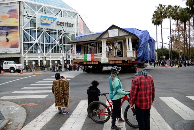SAN JOSE, CALIFORNIA - JANUARY 8: The Poor House Bistro moves slowly past the SAP Center towards its new home in the Little Italy section of San Jose, Calif., Saturday, Jan. 8, 2022. (Karl Mondon/Bay Area News Group)