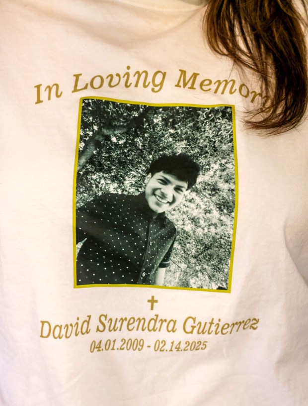 Diana Gutierrez wears a memorial t-shirt with a photo of her nephew, David Gutierrez, at their home in Redwood City, Calif., on Wednesday, July 16, 2025. David Gutierrez, 15, was stabbed to death by a purported 13-year-old gang member at Santana Row while he was on a Valentine's Day date. (Ray Chavez/Bay Area News Group)