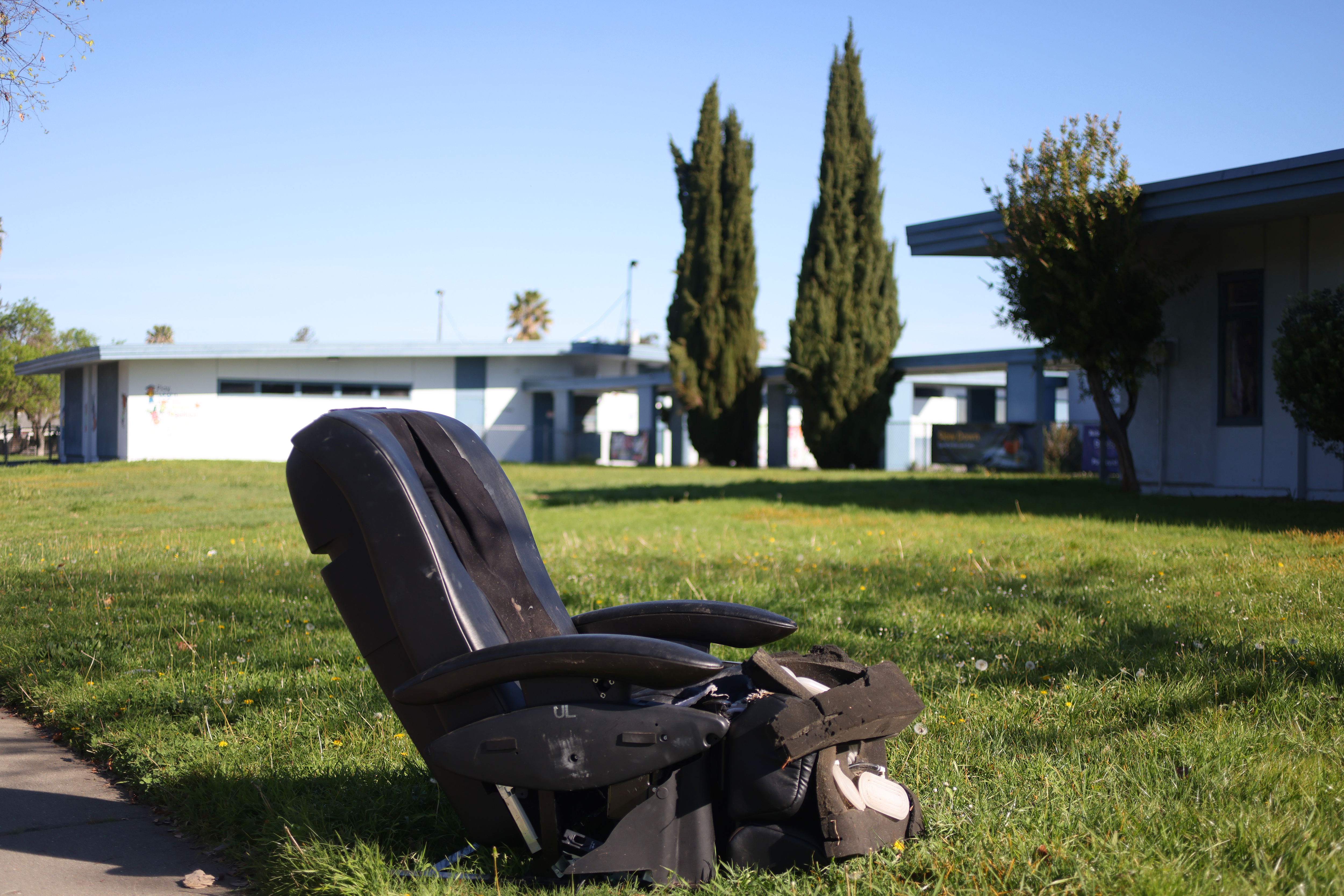 A discarded chair on the front lawn of Sylvia Cassell...