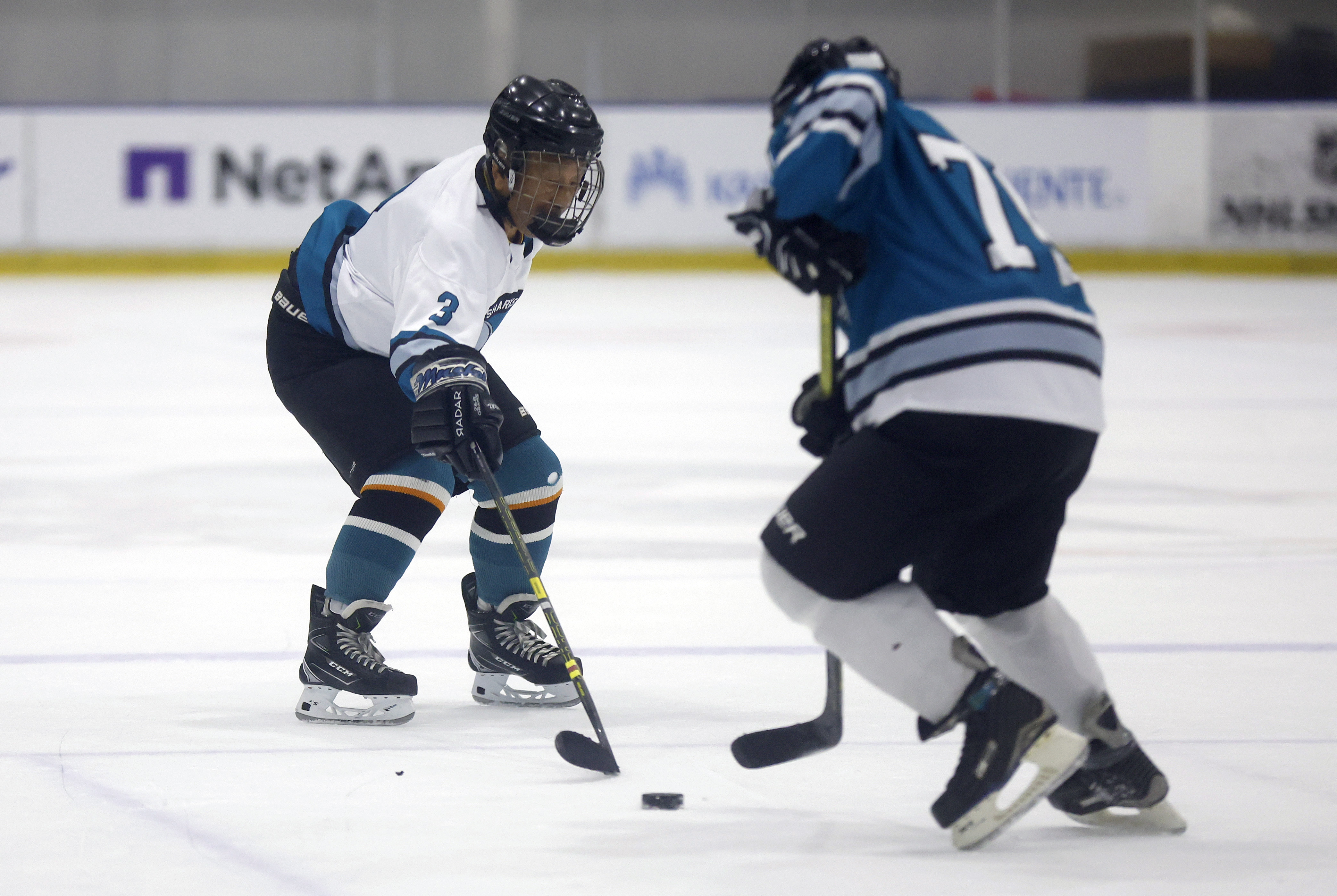 Ed Asato (3), left, 87, from Sunnyvale, defends against another...