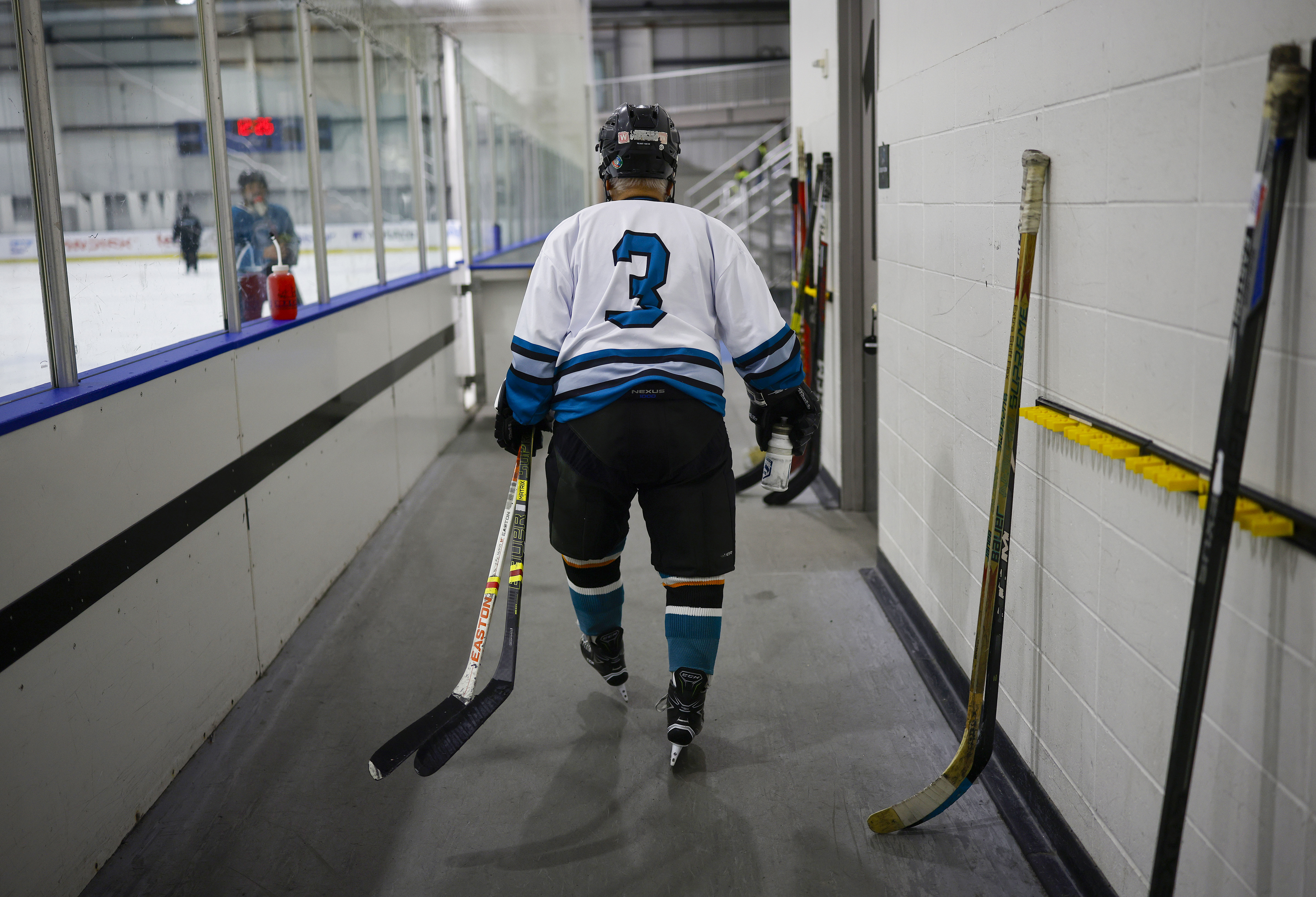 Ed Asato (3), 87, from Sunnyvale, heads to the ice...