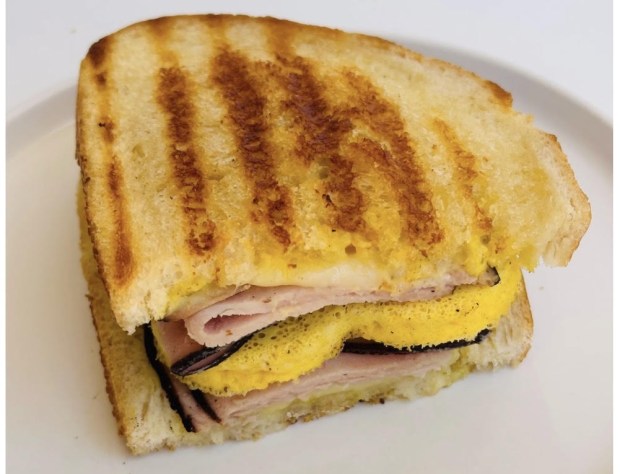 New on the Luv's Brownies menu are a Cuban Breakfast Sandwich, above, with a heart-shaped egg (naturally) and a Cuban Sandwich for lunch or dinner, with the requisite pickle. (Photo courtesy of Luv's Brownies)