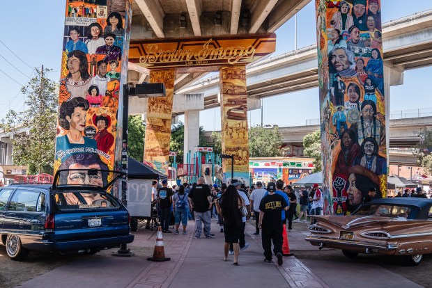 People gather for Chicano Park Day in Barrio Logan on April 19, 2025. (Ariana Drehsler / For The San Diego Union-Tribune)