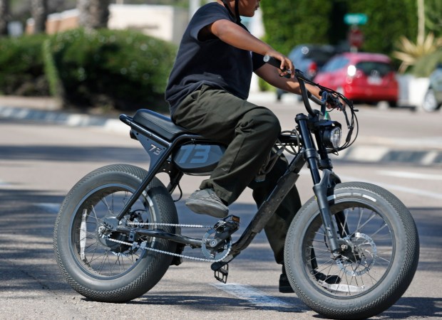 A person rides an e-bike in Pacific Beach on March 4, 2026 in San Diego, CA. (K.C. Alfred / The San Diego Union-Tribune)