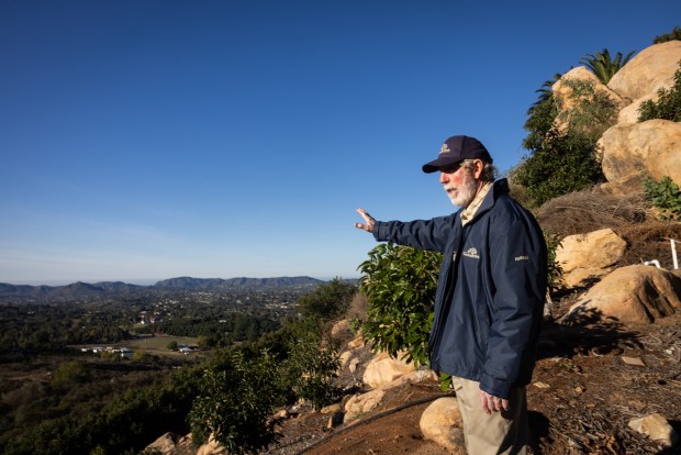 Eddie Grangetto gestures at a view during a tour of his farm on Tuesday, Dec. 2, 2025, in Escondido. (Ana Ramirez / The San Diego Union-Tribune)