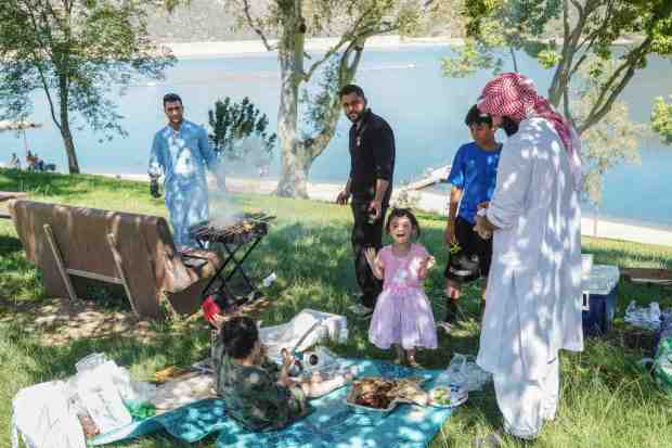 Yasir Mohammed brings his families to Lake Poway and barbecue by the Lake Poway Trail. (Michael Ho / For The San Diego Union-Tribune)