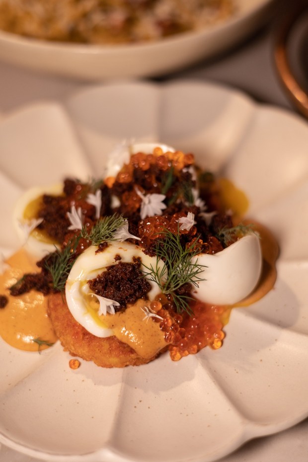 Huntresses' oefus en mayo dish made with soft boiled egg, potato rostie, smoked trout roe, nduja bacon bits, tomato aioli, and dill. (RMD Group)