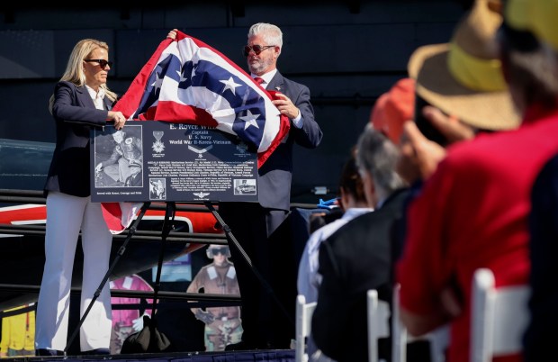 A palque, to be displayed at the Mt. Soledad Memorial, is presented to Capt. Royce Williams aboard the USS Midway museum during a Medal of Honor ceremony on Saturday, March 21, 2026. The ceremony payed tribute to Capt. Williams, a decorated U.S. Navy fighter pilot, who demonstrated extraordinary courage and superior airmanship, during an aerial combat mission during the Korean War nearly 74 years ago. (Sandy Huffaker / For The San Diego Union-Tribune)