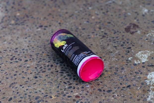 A spray paint can is pictured outside the "Mushroom House" this month. (Kristian Carreon / The San Diego Union-Tribune)