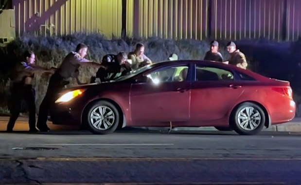 Image from body-worn camera footage from a Feb. 18, 2026 incident in which sheriff's deputies and a Palomar College police officer opened fire on a passenger with a gun in a car pulled over on North Twin Oaks Valley Road. The passenger, Andre Raphael Mendez, died at the scene. (Courtesy San Diego County Sheriff's Office)
