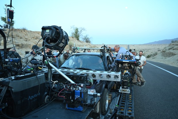 This image released by Warner Bros. Pictures shows Chase Infiniti and Leonardo DiCaprio in a scene from "One Battle After Another." (Michael Bauman/Warner Bros. Pictures via AP)