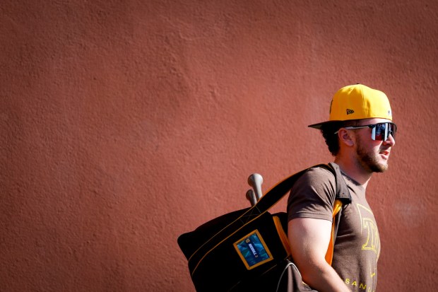 Jackson Merrill walks towards the field during a Feb. 12 spring training workout at the Peoria Sports Complex. (Meg McLaughlin / The San Diego Union-Tribune)
