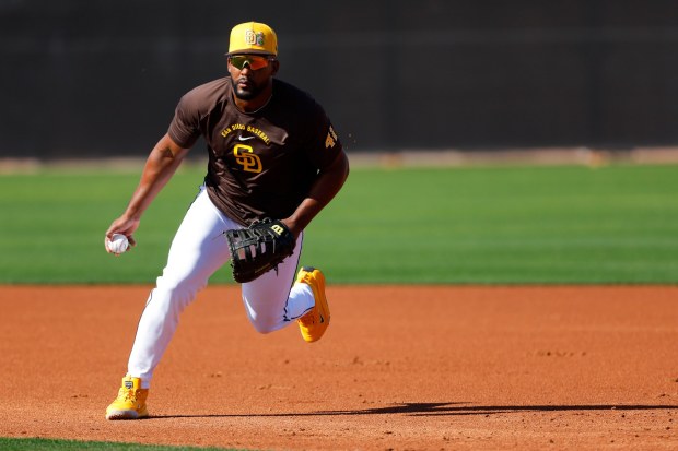 Miguel Andujar #41 of the San Diego Padres participates in drills during spring training workouts at the Peoria Sports Complex on Thursday, Feb. 12, 2026 in Peoria, Ariz.(Meg McLaughlin / The San Diego Union-Tribune)