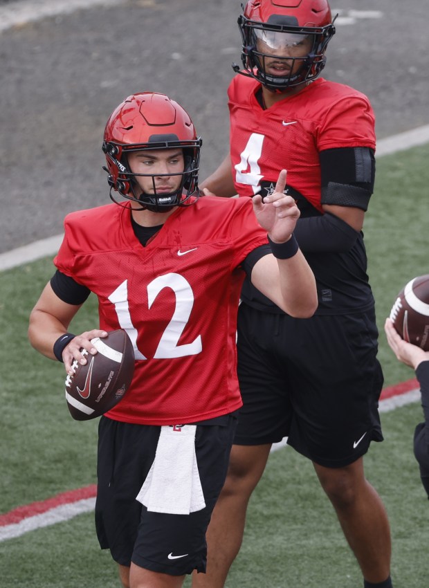 San Diego State quarterbacks Stone Saunders, left, and Jayden Denegal work out during a practice earlier this week. (K.C. Alfred / The San Diego Union-Tribune)