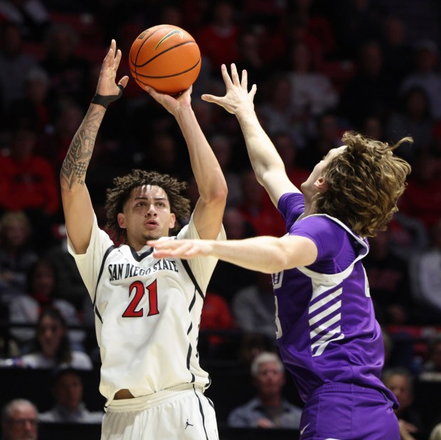 SAN DIEGO - FEBRUARY 17, 2026: The Aztecs' Miles Byrd shoots over Grand Canyon's Dusty Stromer in the second half at the Viejas Arena in San Diego on Tuesday, February 17, 2026. (Hayne Palmour IV / For The San Diego Union-Tribune)