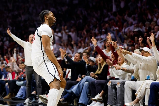 Taj Degourville #24 of San Diego State celebrates after three-pointer against UNLV at Viejas Arena on Friday, March 6, 2026 in San Diego, California. (Meg McLaughlin / The San Diego Union-Tribune)