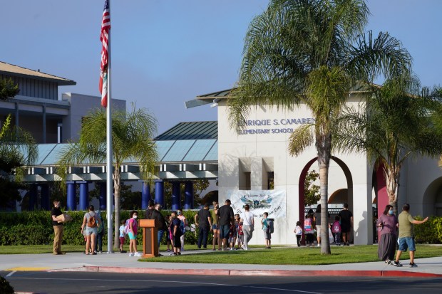 Children arrive at Enrique S. Camarena Elementary School on Wednesday, July 21, 2021, in Chula Vista. (Nelvin C. Cepeda / The San Diego Union-Tribune)