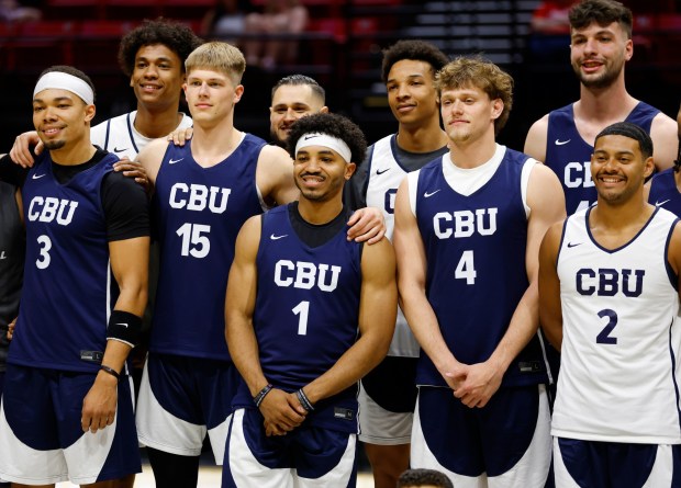 Dominique Daniels Jr. #1 of Cal Baptist takes a photo with teammates before a practice for the NCAA Men's Basketball Tournament at Viejas Arena on March 19, 2026 in San Diego, CA.(K.C. Alfred / The San Diego Union-Tribune)