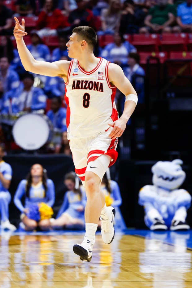 Ivan Kharchenkov #8 of Arizona reacts after a three-point basket against LIU during the first round of the 2026 NCAA Men's Basketball Tournament at Viejas Arena on Friday, March 20, 2026 in San Diego, California. (Meg McLaughlin / The San Diego Union-Tribune)