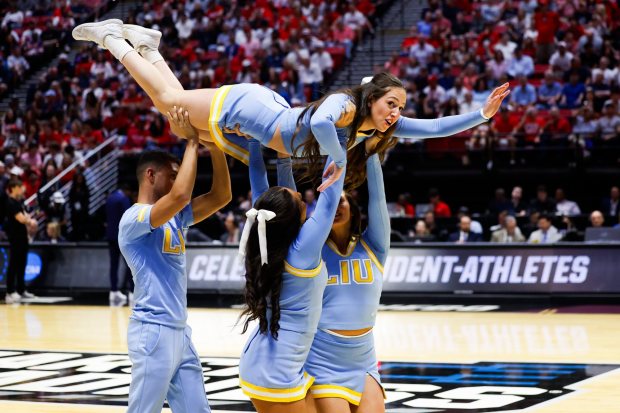 LIU cheerleaders perform during a timeout in the first round of the 2026 NCAA Men's Basketball Tournament game against Arizona at Viejas Arena on Friday, March 20, 2026 in San Diego, California. (Meg McLaughlin / The San Diego Union-Tribune)