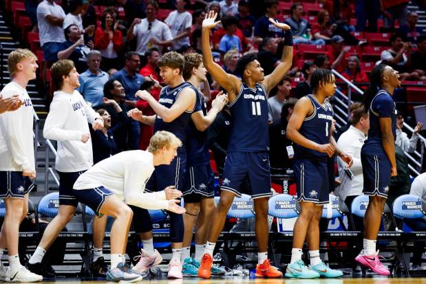 Utah State bench celebrates during the first round of the 2026 NCAA Men's Basketball Tournament against Villanova at Viejas Arena on Friday, March 20, 2026 in San Diego, California. (Meg McLaughlin / The San Diego Union-Tribune)