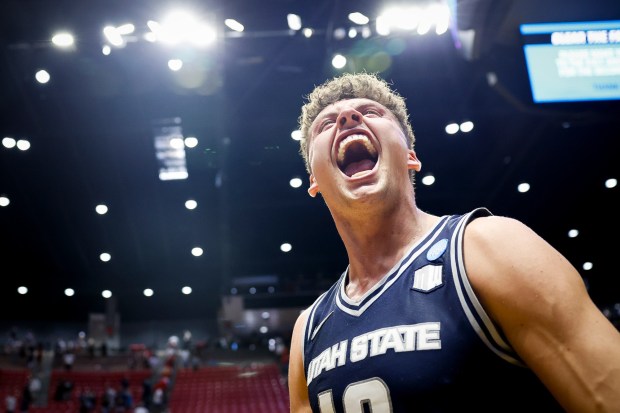 Mason Falslev #12 of the Utah State celebrates after the Aggies defeated Villanova during the first round of the 2026 NCAA Men's Basketball Tournament at Viejas Arena on Friday, March 20, 2026 in San Diego, California. (Meg McLaughlin / The San Diego Union-Tribune)